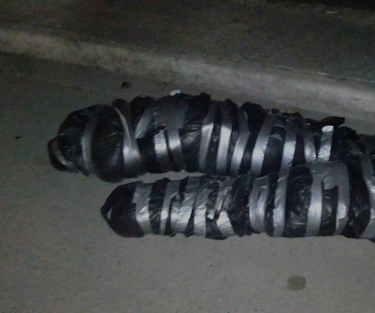 Hallan dos cadáveres embolsados Hallan dos cadáveres embolsados