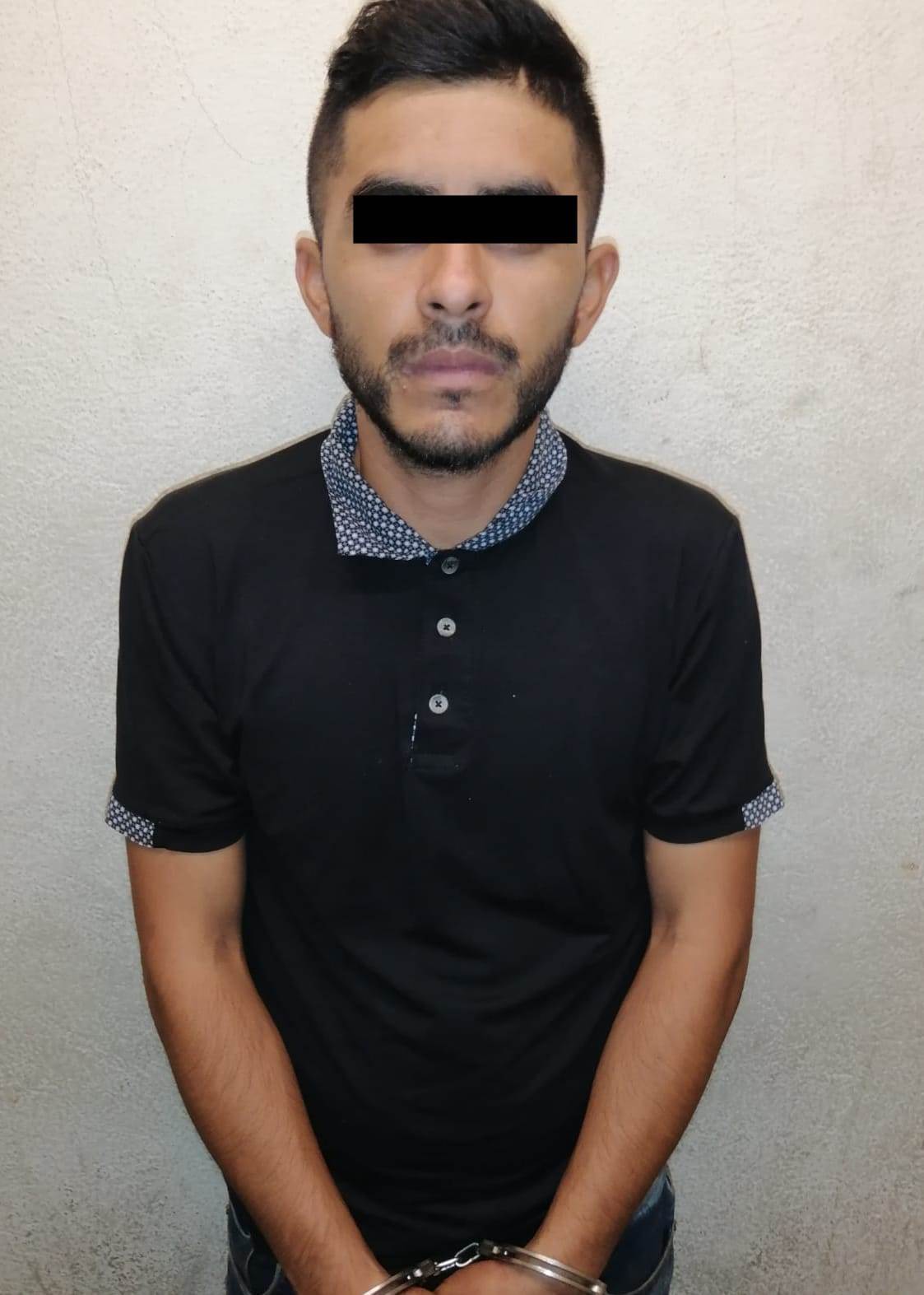 Llevaba un arma de fuego y un cargador abastecido con 18 cartuchos