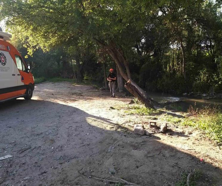 Hallan cadáver flotando en río