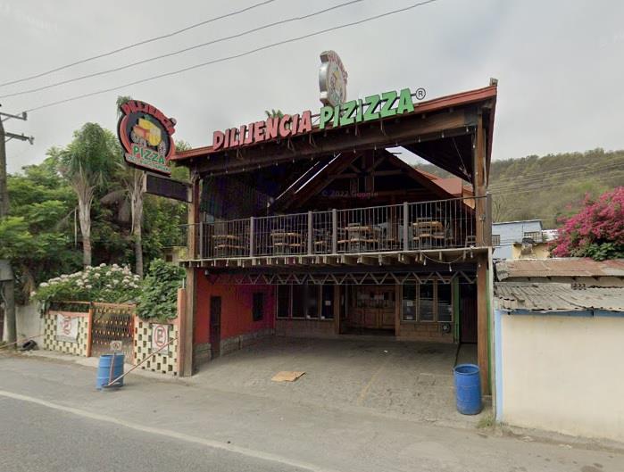 Encuentran a joven muerto en pizzería de Santiago
