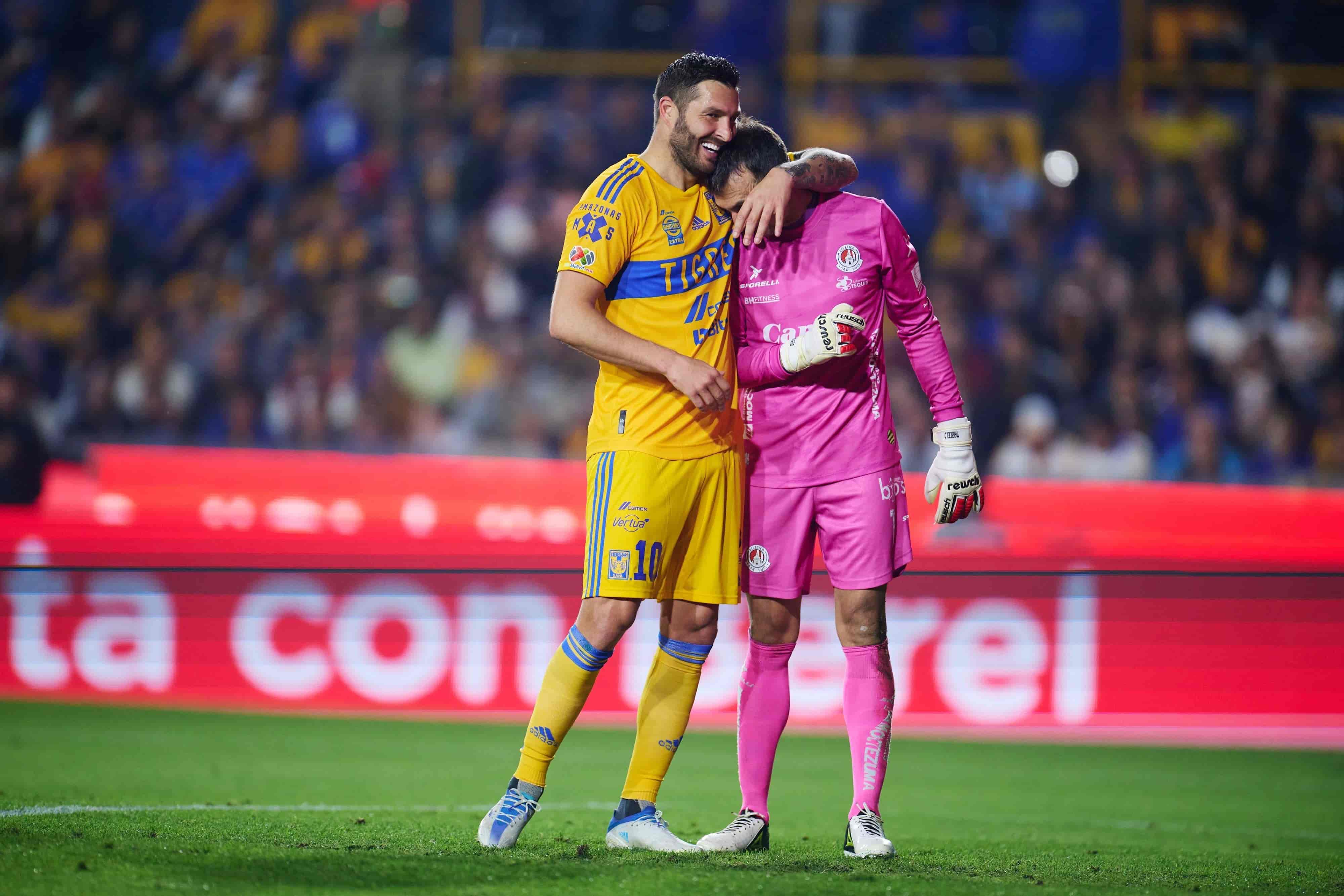 André Pierre Gignac y Marcelo Barovero.