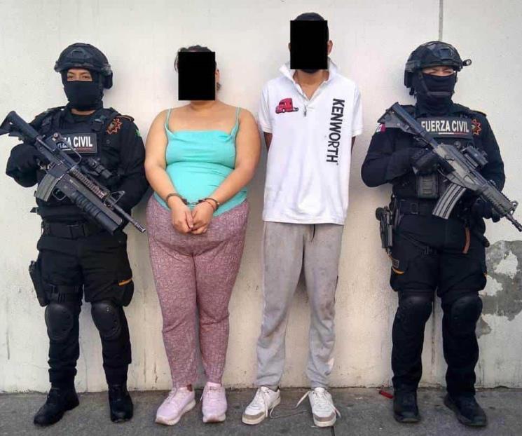 Cae pareja con arma y droga