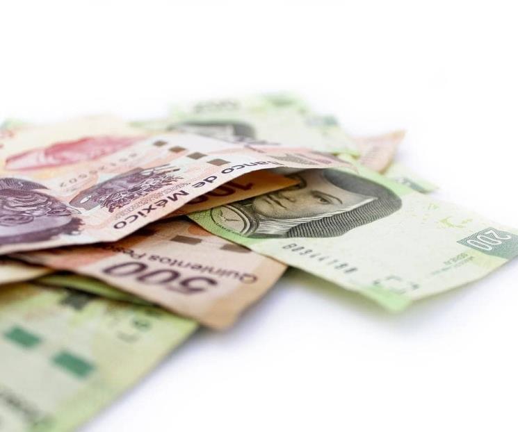 Peso cae frente al dólar y cierra en 20.52