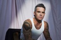 Desea Robbie Williams abrir concierto de Oasis