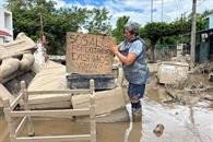 Vecinos piden apoyo para limpiar lodo en Poza Rica Vecinos piden apoyo para limpiar lodo en Poza Rica